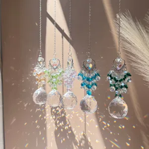 Crystal suncatcher hanging prism ball with heart charm for window garden and home decor.