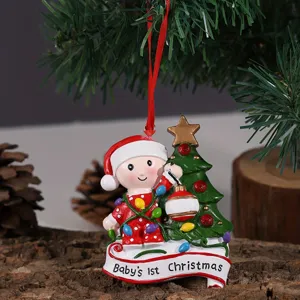 Resin baby Christmas tree hanging ornament detail showing cute holiday decor design and festive text.