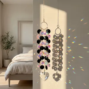 Crystal suncatcher prism pendant detail casting colorful rainbow light refractions indoors.