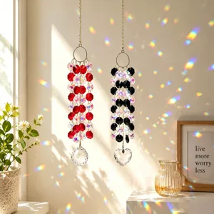 Detailed view of crystal suncatchers hanging by window, casting beautiful rainbow light reflections indoors.