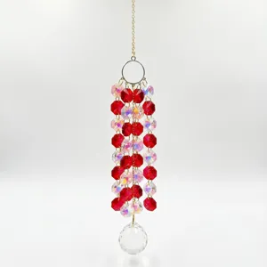 Detailed view of crystal suncatcher pendant, hanging beads and clear prism ball for window decor.