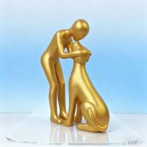 Gold resin human and dog sculpture figurine detail view, modern Nordic home decor ornament.