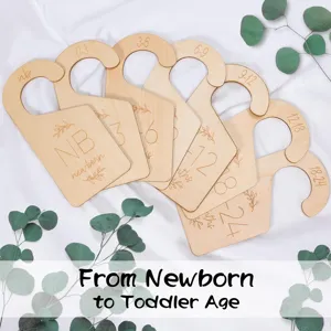 Wooden baby closet dividers detail view showing natural wood grain and engraved month numbers.