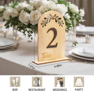 Wooden table number card with floral hollow design for rustic wedding party decor detail