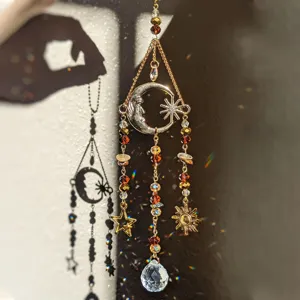 Crystal moon suncatcher hanging ornament, beautiful light refraction for home and garden decor.