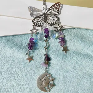 Close-up detail of the crystal prism butterfly hanging ornament with purple crystal chips and stars.