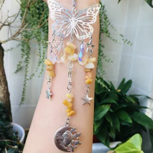 Detailed crystal butterfly suncatcher with yellow healing stones and cute moon pendant.