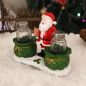 Christmas Santa Claus salt and pepper shaker set with glass bottles and resin decorative base for kitchen table.