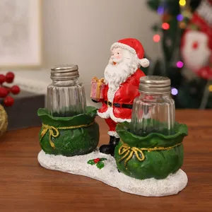 Christmas Santa Claus salt and pepper shaker set detail view, decorative resin kitchen seasoning jars