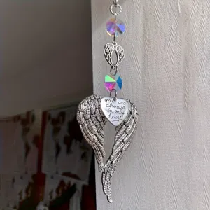 Attrape-soleil en cristal ailes d'ange suspendues avec pendentif coeur grave pour decoration.