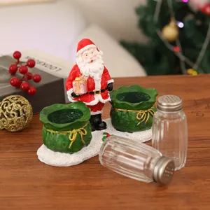 Detailed view of Christmas Santa figurine salt pepper shaker set festive tabletop decor
