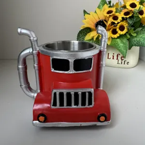 Novelty truck shaped coffee mug with stainless steel inner liner and creative smokestack handle.