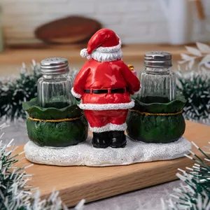 Christmas Santa Claus salt and pepper shaker set with resin sculpture for kitchen table decor.