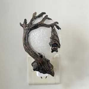 Detailed view of Halloween bat and tree night light plug-in design, spooky home decor accent.