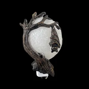 Detailed view of Halloween hanging bat night light featuring textured tree branch and moon globe.