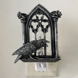 Gothic crow night light featuring a raven on vintage window frame, plug-in Halloween decor.