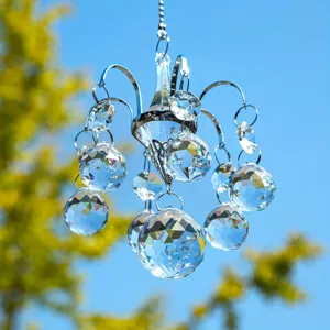 Crystal chandelier suncatcher hanging ornament with faceted crystal balls and silver frame.