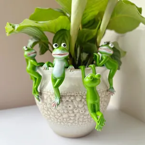 Detailed view of cute green resin frog plant pot hanging decorations for garden and home.