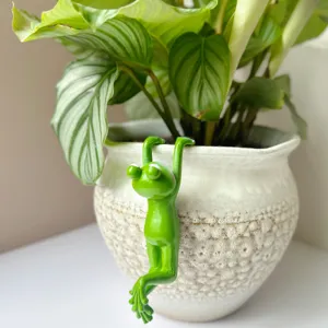 Green frog resin figurine detail shot, creative bonsai pot hanging ornament for home garden decor.