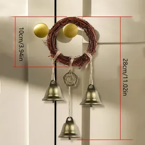 Boho woven vine wreath door bell hanging with vintage metal bells and pentagram pendant detail