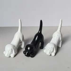 Creative resin dog figurine ring holder, cute animal home decor ornament for living room desk.
