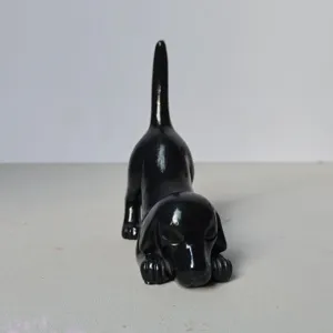 Detailed view of a cute black resin dachshund figurine, perfect for home decor and tabletop.