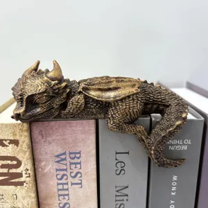 Sleeping dragon resin bookend figurine, antique bronze finish desktop fantasy shelf decor.