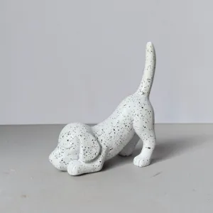 Close-up detail of the creative resin spotted dog ornament showing fine texture and cute pose.