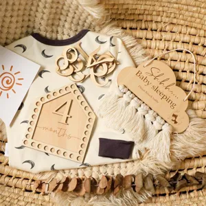 Nordic style baby sleeping door sign and monthly milestone wooden plaque set for nursery decor.