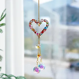 Crystal suncatcher detail view, multi-colored rhinestone heart pendant for indoor home decor.