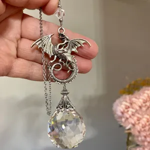 Detailed view of vintage dragon suncatcher crystal ball pendant hanging decoration.