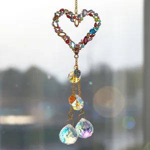 Crystal suncatcher hanging ornament with colorful rhinestones and faceted crystal prism balls.