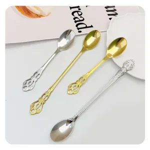 Stainless steel vintage coffee spoons with intricate embossed handle design for table decor.