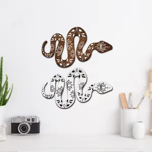 Bohemian style wooden snake wall decor detail, carved leaf pattern art sign for home.