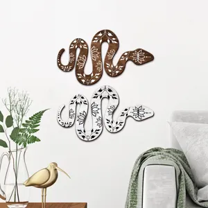 Bohemian style wooden snake wall art plaque, detailed view of floral decor for home.