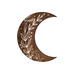Wooden crescent moon wall decor detail featuring botanical leaf line art and white dots.