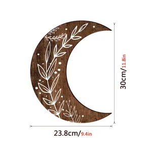 Wooden crescent moon wall decor with carved white leaf pattern, boho home room decoration.