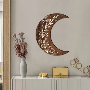 Bohemian wooden crescent moon wall art with white leaf botanical pattern home decor detail