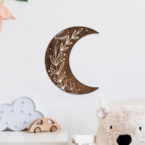 Wooden moon wall decor with bohemian carved leaf design, perfect for nursery and home styling.