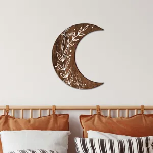 Wooden moon wall hanging with white leaf pattern boho home decor detail view aesthetic bedroom.
