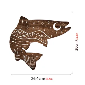Wooden fish wall art detail view, bohemian carved animal decor with moon and mountain pattern.