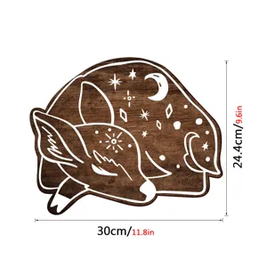 Detailed view of the bohemian style wooden deer wall plaque with moon and star cutout design.