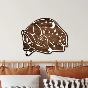 Wooden wall art featuring a sleeping deer with celestial moon stars design for bohemian bedroom decor detail view