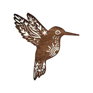 Wooden hummingbird wall decor with bohemian carved floral sun pattern detail close-up
