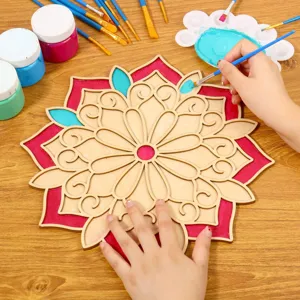Detailed shot of wooden mandala DIY painting kit showing creative process with brushes and vibrant colors.