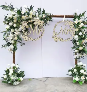 Wooden wedding Mr and Mrs hanging signs detail scene, perfect for chair back and arch decor.