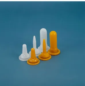 Silicone pet feeding nipple detail showing various sizes and colors for newborn puppies.