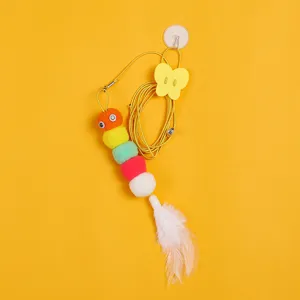 Hanging cat teaser toy with colorful pom-pom caterpillar and feather tail for indoor pets.