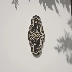 Mystic wooden wall decor featuring an evil eye design, perfect for esoteric boho home styling.