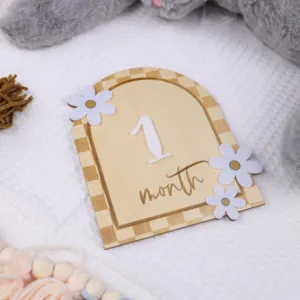 Wooden monthly milestone card with 3d daisy flower newborn baby photo props detail.